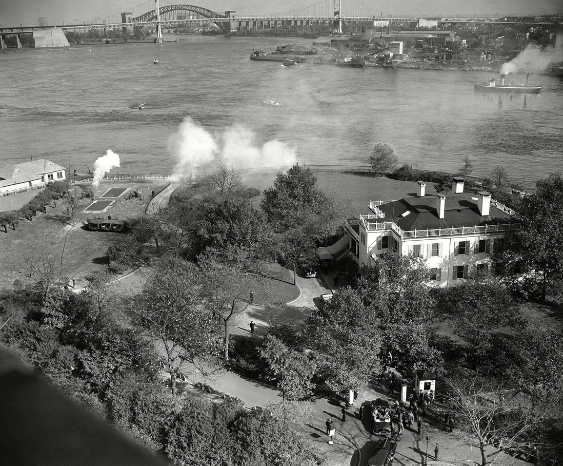 Gracie Mansion is shown during President Truman's visit to New York City, . Smoke at left is the firing of the gun salute. 1949.